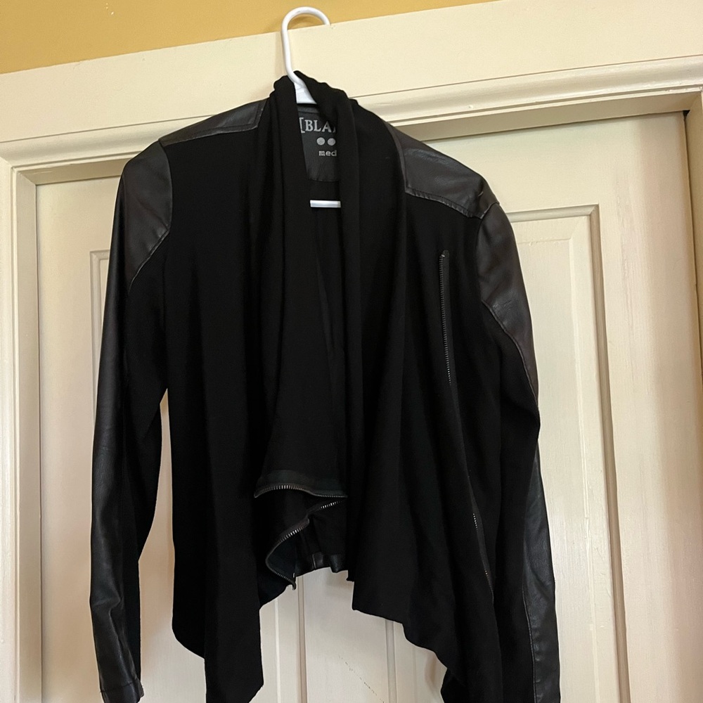 Black bomber like jacket with faux leather.